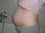 Mavebilleder med tvillinger - Uge 19. Vægten siger nu plus 7 kg og der er heftig aktivitet i maven. Og man begynder at kunne mærke de ekstra kilo.