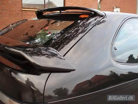 Toyota corolla solgt - spøjlerne set fra siden billede 16