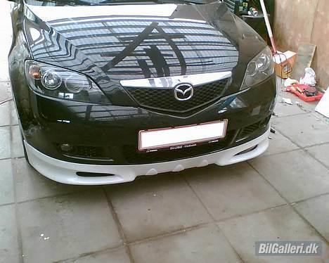 Mazda 2 1,4 mirai SOLGT - den nye læbe. side skørte og bag skørt samt tagspoiler bliver først vist efter de er malet billede 11