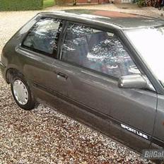 Mazda 323 sportline solgt