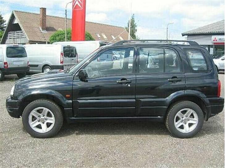 Suzuki Grand Vitara - solgt - den ene side billede 1