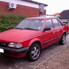 Mazda 323 1,3 Bf m. karb  SOLGT