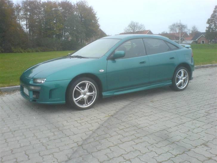 Mazda 323F BA - SOLGT. billede 1