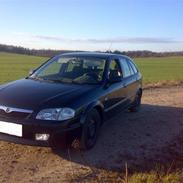 Mazda 323F Bj. solgt