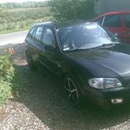 Mazda 323F Bj. solgt