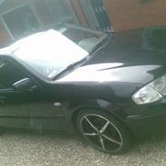 Mazda 323F Bj. solgt