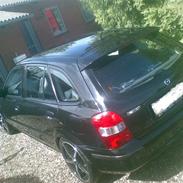 Mazda 323F Bj. solgt