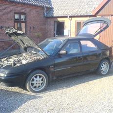 Mazda 323F GT (ophugget)