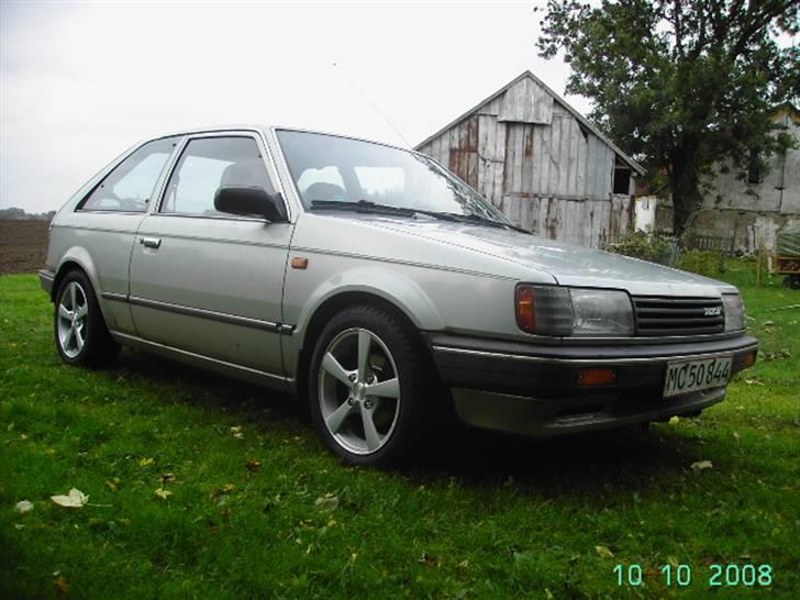 Mazda 323 1,3 bf (skrottet) billede 1