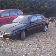 Mazda 323f lige blevet smadret