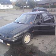 Mazda 323f lige blevet smadret