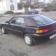 Mazda 323f lige blevet smadret