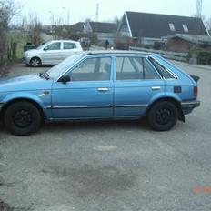 Mazda 323 LX 1,5 solgt