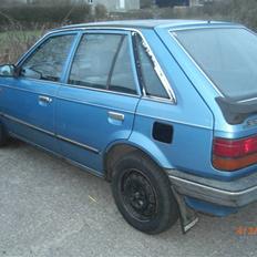 Mazda 323 LX 1,5 solgt