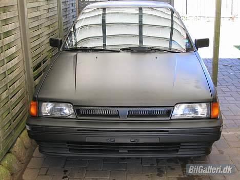 Nissan Sunny - Ond, hva? Bare et par nye spejle.. billede 1