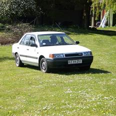Mazda 323 sedan 1.3 16v solgt
