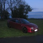 Mazda 323 F ba solgt.