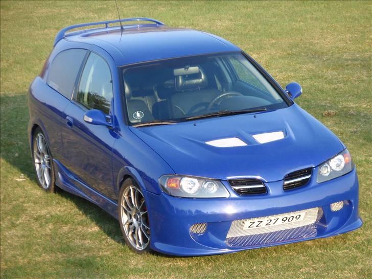 Nissan Almera 1,8 Sport SOLGT billede 10