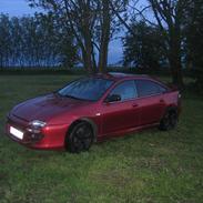 Mazda 323 F ba solgt.