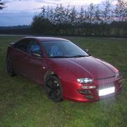 Mazda 323 F ba solgt.