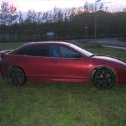 Mazda 323 F ba solgt.