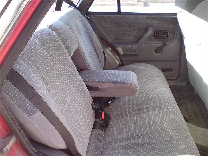 Ford Escort 1,3 Ghia solgt - Armlæn billede 2