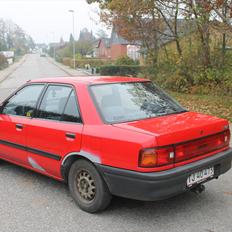 Mazda 323i (totalskadet)