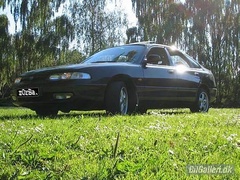 Mazda 626 2.0 i - set fra den anden side forfra billede 1