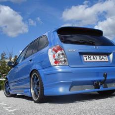 Mazda Aqua 323F BJ solgt