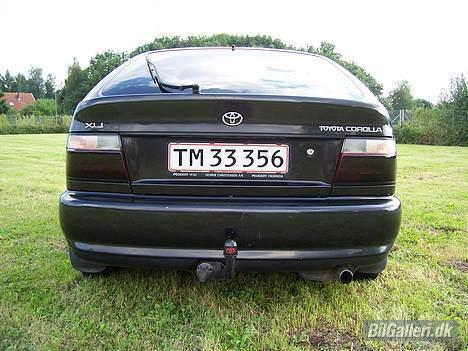Toyota Corolla 1,3 Xli - Solgt   - Billede taget den 19.08.2006 - Det pynter med en kapsel med logo. billede 3