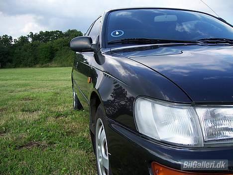 Toyota Corolla 1,3 Xli - Solgt   - Billede taget den 19.08.2006 - God profil af bilen. billede 5