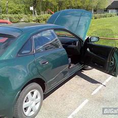 Mazda 323 F 6/98 Solgt..