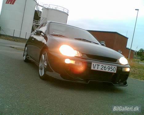 Mazda 323 c (regnbuen) solgt billede 15