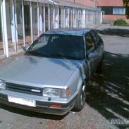 Mazda 323 1,6 gt/x 2talt skadet