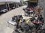 Filippinerne. Honda CB500X. - . . . . . . . . . . . . . . . . . . . . . .  Parkering i baggård med vagt ved kaffebar.
