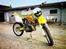 Suzuki 125 RM (Enduro modificeret) - Ja, enig, forlygten er hæslig, men den var billig og skal være der når man kører Enduro. Skriv gerne hvis i har en original Suzuki enduro forlygte der passer på.