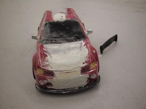 Bil Mitshubishi Lancer Evo PT - Skråt oppe- forfra billede 1