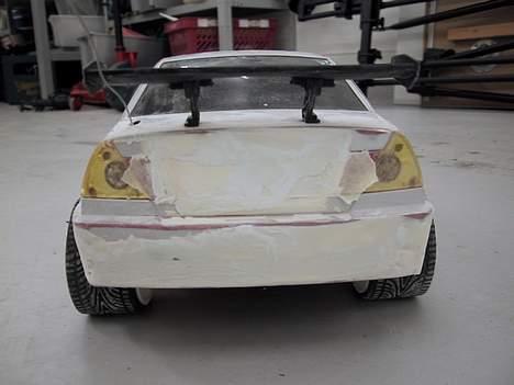 Bil Mitshubishi Lancer Evo PT - Bagenden med den nye spoiler på billede 6