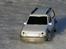 Bil Toyota Land Cruser - Forfra i solskinnet