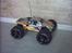Truck Traxxas Revo TRX 2.5R - Revo´en med sorte fælge, sorte bumpers, og gul karros...