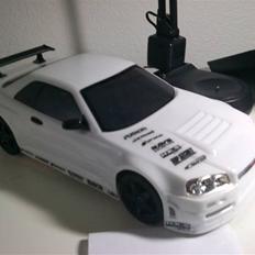 Bil TT-01D - Nissan Skyline GTR R34 Vspec II