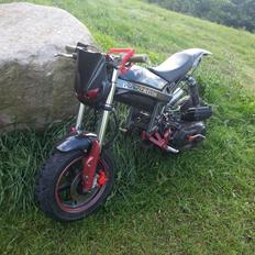 Suzuki street magic (ssm) baghjuls maskinen