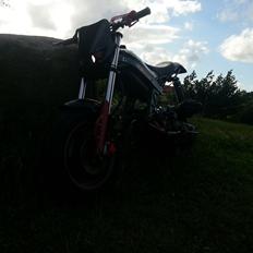 Suzuki street magic (ssm) baghjuls maskinen